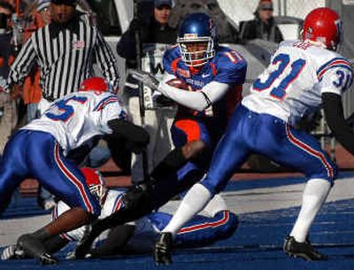 
Although Boise State is 11-0, Drisan James (11) and his teammates slipped a notch in the BCS standings and won't get to showcase their talents in a big-money BCS bowl game. 
 (Associated Press / The Spokesman-Review)