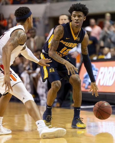 In this Dec. 22, 2018 photo, Murray State guard Ja Morant (12) works around Auburn guard Bryce Brown (2) during the first half of an NCAA college basketball game, in Auburn, Ala. Morant, Darius Garland and Coby White make up a clear top tier of point guards in next week’s NBA draft. (Vasha Hunt / Associated Press)