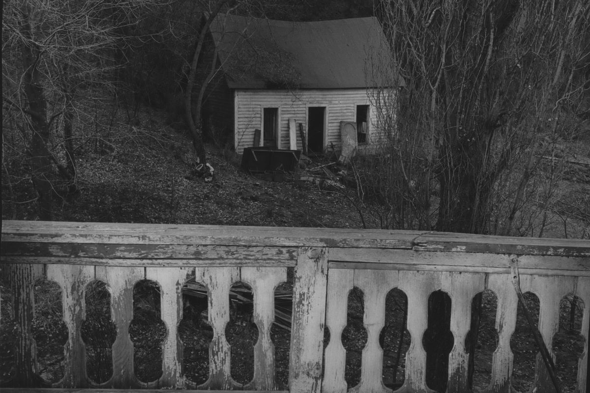 The 1870 cabin of this early settler was enlarged and then given a board front to be in harmony with the house. It is close to the bluff and was beside a trail traveled before the area was settled. 1973 photo  (The Spokesman-Review photo archive)