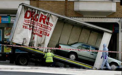 
A Mercedes car is loaded onto a removals truck in Haymarket Street, near Piccadilly, in central London, Friday after it was found to contain a suspected car bomb. Photos by Associated Press
 (Photos by Associated Press / The Spokesman-Review)