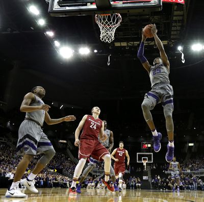 Kansas State's Wesley Iwundu (25) gets past Washington State's Josh Hawkinson (24) to shoot during the first half of a 2016 game in Kansas City, Mo. The Cougars and Wildcats meet again on Wednesday in Spokane. (Charlie Riedel / AP)