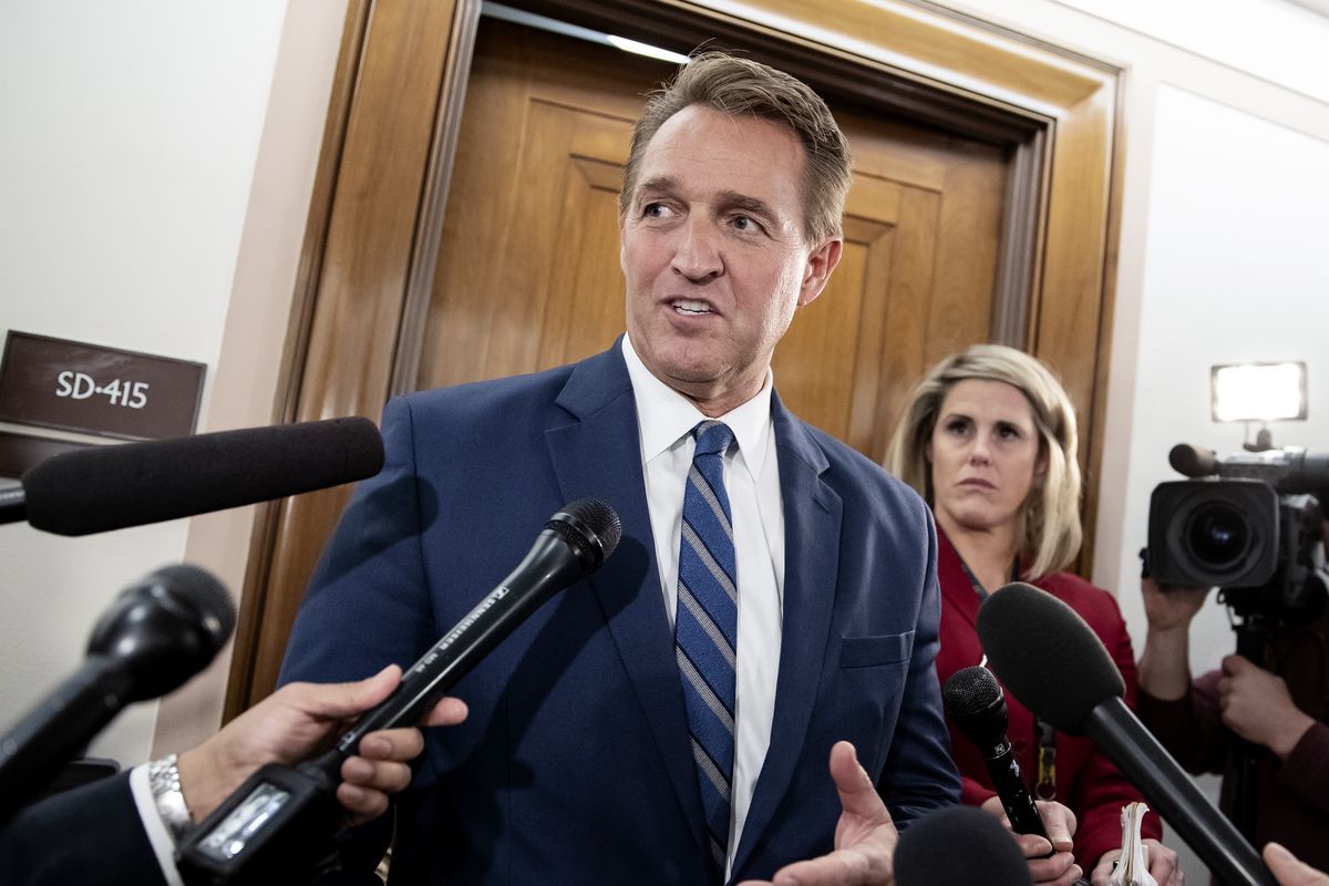 FILE - In this Dec. 6, 2018 file photo, Sen. Jeff Flake, R-Ariz., speaks with reporters on Capitol Hill in Washington, Thursday, Dec. 6, 2018. President Joe Biden on Tuesday nominated former senator Jeff Flake to serve as ambassador to Turkey. The Republican had endorsed Biden