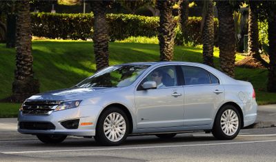 The 2010 Ford Fusion Hybrid will get 41 city miles per gallon and 36 mpg on highways.  (Associated Press / The Spokesman-Review)