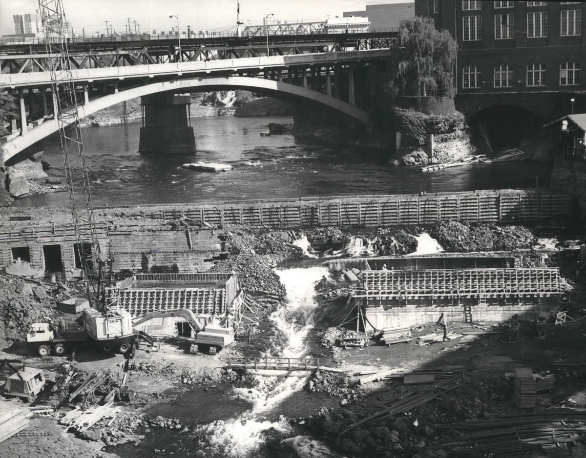 1972 – Heavy spring flows damaged the 1890 rock-and-timber dam on the Spokane River. Repairs were quickly started while waiting for Federal Power Commission permits. Washington Water Power built a new concrete dam 40-50 downstream from the original and remodeled the intake and penstocks. A park, called Huntington Park, was created on the south side of the river. It was named after D.L. Huntington, third president of WWP. (The Spokesman-Review Photo Archive / S-R archives)
