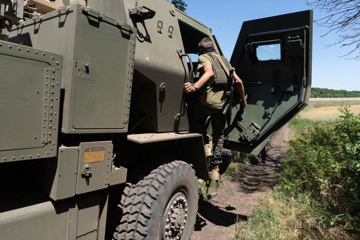 A Ukrainian soldier gets inside a HIMARS vehicle in Eastern Ukraine on July 1.  (Anastasia Vlasova/For The Washington Post)