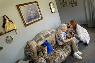 
Nurse practitioner Melody Bemis of Mobile Medical Clinic talks with Marie Henderson, 92, at a group home Thursday in Spokane Valley. The clinic is in financial trouble because of constant delays in receiving Medicare-Medicaid reimbursements. 
 (Brian Plonka / The Spokesman-Review)