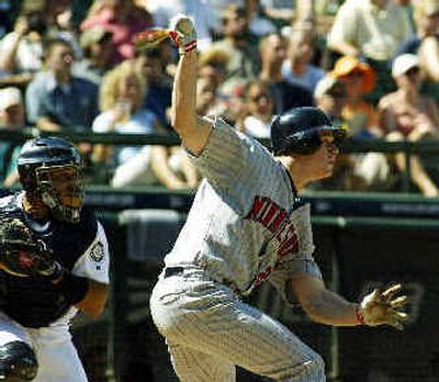 
Minnestota Twins designated hitter Justin Morneau watches his second homer of the game Thursday at Safeco Field.
 (Associated Press / The Spokesman-Review)