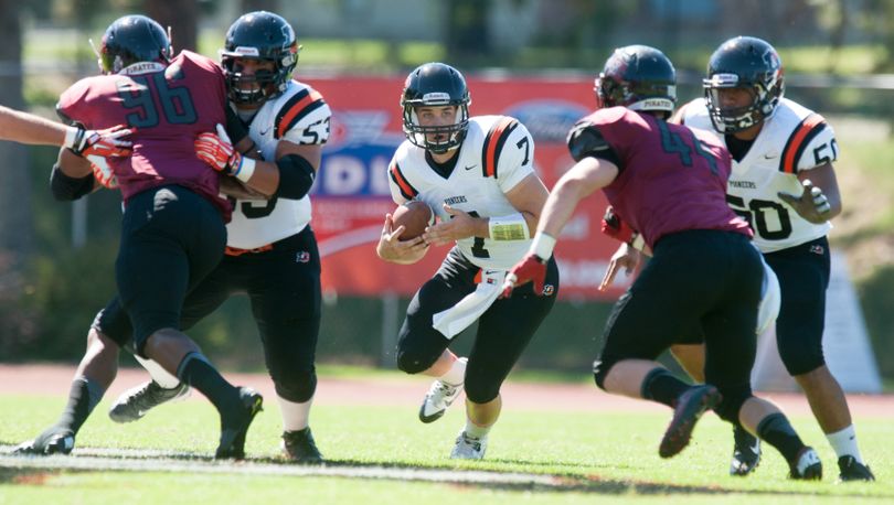 Lewis & Clark quarterback Zach Littlefield (7) runs the ball against Whitworth during a college football game on Saturday, Sept. 6, 2014, at Whitworth University  in Spokane, Wash.  TYLER TJOMSLAND (Tyler Tjomsland)