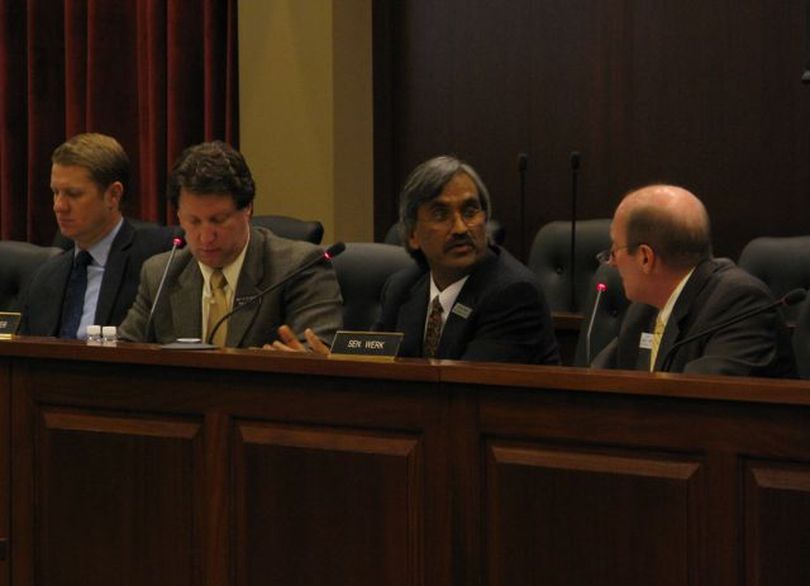 Sen. Elliot Werk, D-Boise, right, questions Office of Performance Evaluations Director Rakesh Mohan, second from right, during a meeting of the Joint Legislative Oversight Committee on Tuesday; at left is Sen. John McGee, R-Caldwell, and Rep. Cliff Bayer, R-Boise. (Betsy Russell)