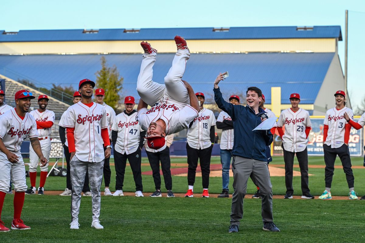 Spokane Indians utility player Colin Simpson performs a backflip to win $100.00 for the best player introduction from announcer Greg Talbot during the team’s Fan Fest event on Wednesday at Avista Stadium.  (COLIN MULVANY/THE SPOKESMAN-REVIEW)
