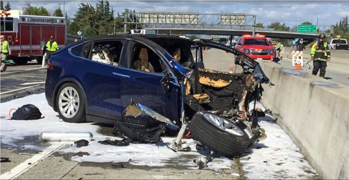 FILE – In this March 23, 2018, file photo provided by KTVU, emergency personnel work a the scene where a Tesla electric SUV crashed into a barrier on U.S. Highway 101 in Mountain View, Calif. The Apple engineer who died when his Tesla Model X crashed into the concrete barrier complained before his death that the SUV’s Autopilot system would malfunction in the area where the crash happened. The driver of another Tesla involved in a fatal crash that California highway authorities said may have been on operating on Autopilot posted social media videos of himself riding in the vehicle without his hands on the wheel or foot on the pedal. The May 5, 2021, crash in Fontana, a city 50 miles (80 kilometers) east of Los Angeles, is also under investigation by the National Highway Traffic Safety Administration. The probe is the 29th case involving a Tesla that the federal agency has probed.  (TEL)