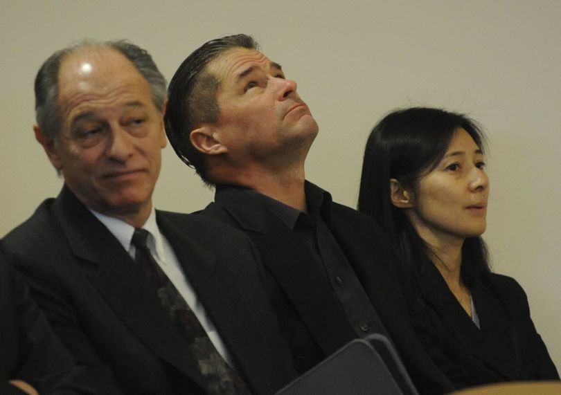 Richard Heene, center, looks up as he sits in the courtroom with his wife Mayumi, right, and attorney David Lane, left, before he and his wife were sentenced in connection with the balloon boy hoax on Wednesday, Dec. 23, 2009, in Fort Collins, Colo. (AP Photo/Rich Abrahamson, Pool)
 (AP Photo/Rich Abrahamson)