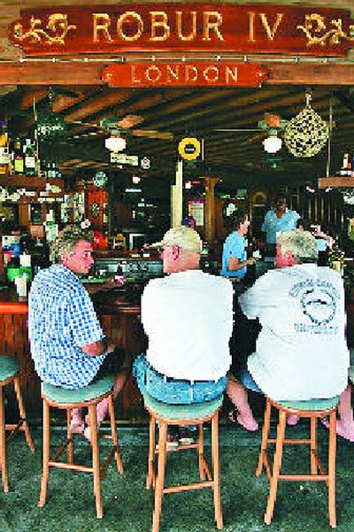 
Men drink and talk at the open bar in Charlotte Amalie, St. Thomas, U.S. Virgin Islands.
 (Associated Press / The Spokesman-Review)