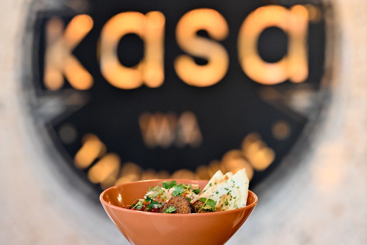 Kasa’s Pork Belly Butter Curry Bowl is photographed on Friday, May 12, 2023,in Spokane, Wash. The bowl features pickled carrots, radish and cabbage slaw with tomato & citrus chutney and is garnished with cilantro. (Tyler Tjomsland/The Spokesman-Review)