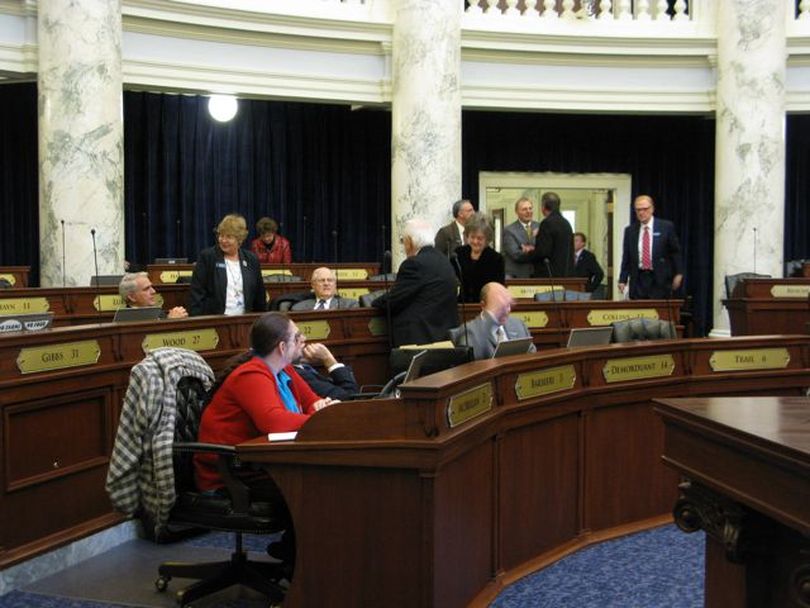 House members mill around on the House floor during Thursday's organizational session, where they waited all day for word on committee assignments and chairmanships. (Betsy Russell)