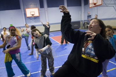 Dance instructor Cindy Hamilton teaches students in her HYPER-Formance Jazz Dance Club, the zombie dance moves to Michael Jackson’s “Thriller” Thursday at the YWCA. On March 15, students will perform at the Bing Crosby Theater. (Colin Mulvany / The Spokesman-Review)