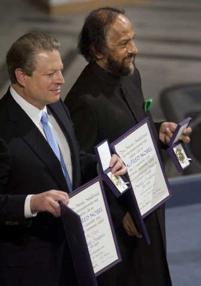 
Nobel Peace Prize winners Al Gore and Rajendra Pachauri, the U.N. climate panel's chief scientist, hold their medals and diplomas Monday  in Oslo. Associated Press
 (Associated Press / The Spokesman-Review)