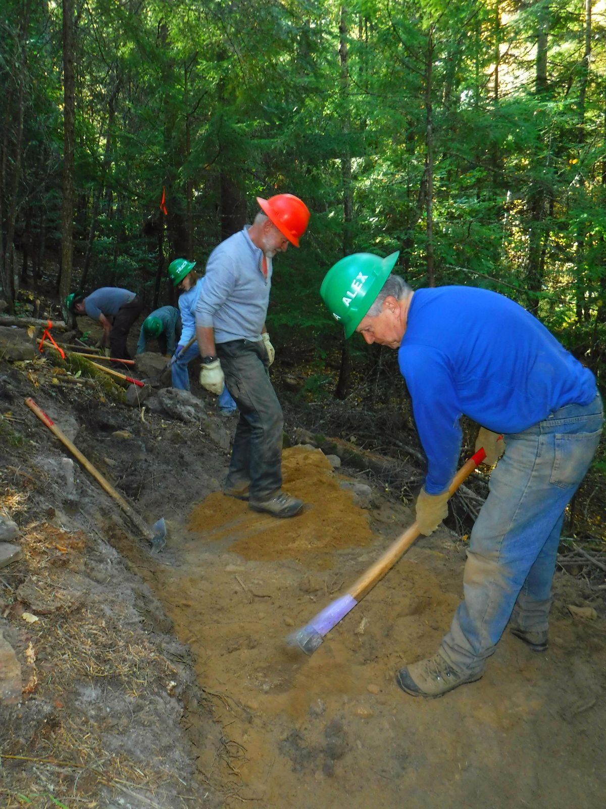 Alex Peridian puts his muscle into a trail project on Mount Spokane.