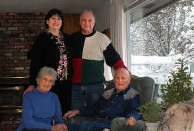 
Frank and June Potter, seated, say that Craig and Sharon Weddle, standing, are great neighbors. Craig Weddle brings his snowblower around the corner to the Potters on snowy days. 
 (Jesse Tinsley / The Spokesman-Review)