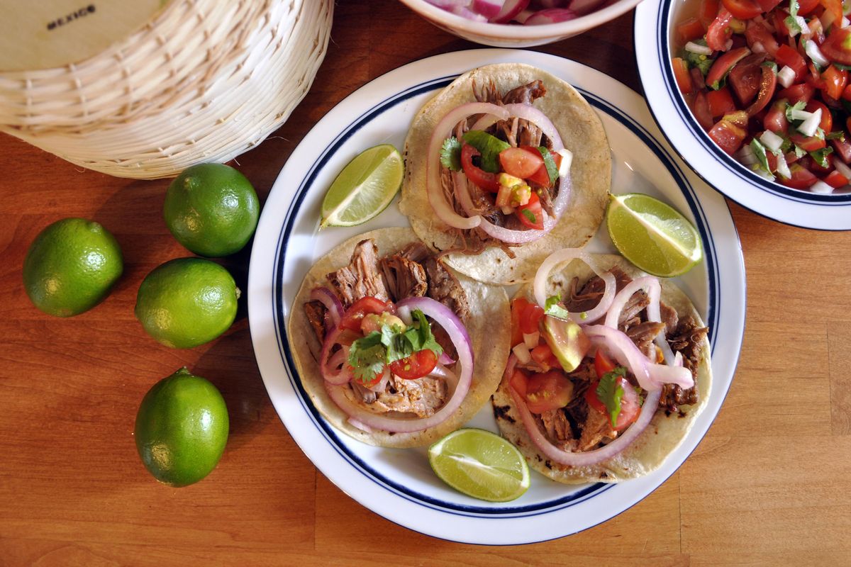Slow-cooked, Mayan-spiced pork worth the wait. (Adriana Janovich / The Spokesman-Review)