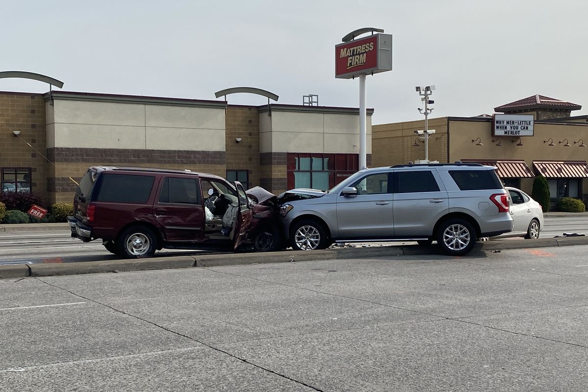 Three people were sent to the hospital Wednesday after a four-car, head-on collision at the intersection of Division and Francis.  (Emma Epperly / The Spokesman-Review)