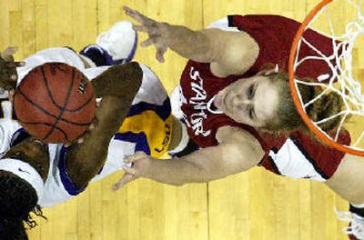 
LSU center Sylvia Fowles, left, take a shot over Stanford forward Kristen Newlin in the first half of their regional final. 
 (Associated Press / The Spokesman-Review)