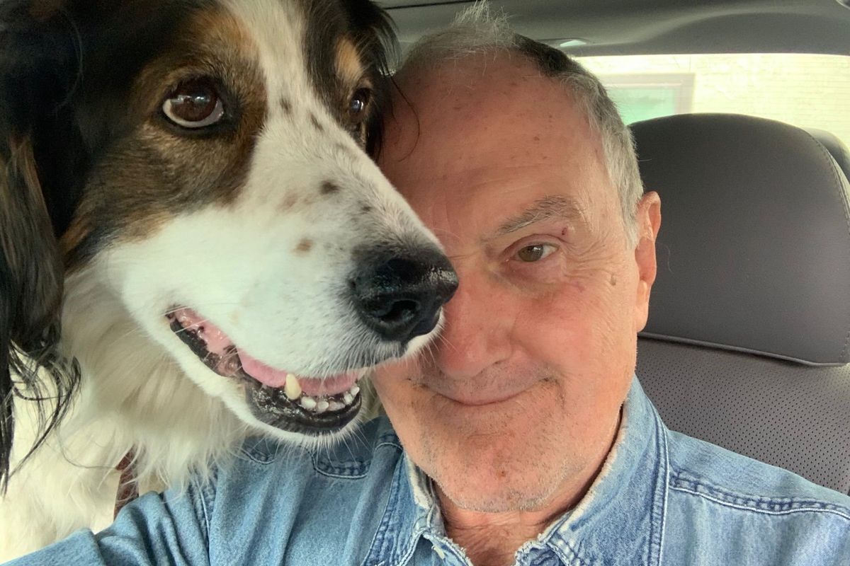 Keith Johnson with his 13-year-old rescue dog, Gita. After he fell in the wilderness outside his cabin in Stevens County the dog went and got help.  (Courtesy of Keith Johnson)