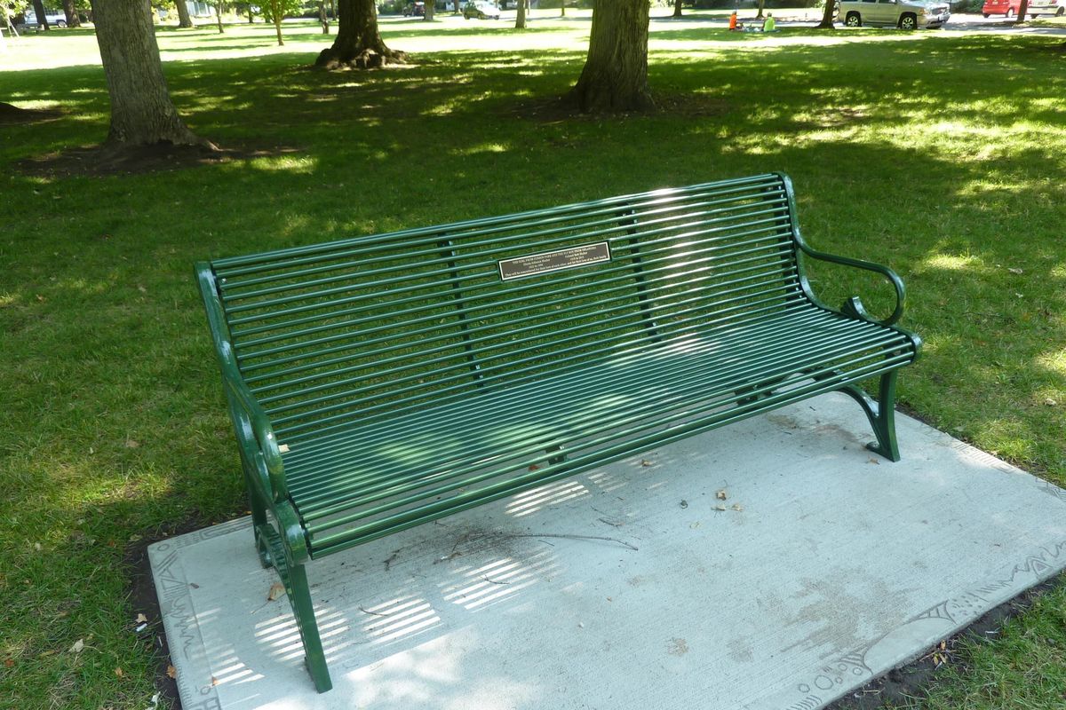 The Shaber children had this bench installed at Corbin Park as a memorial to their parents. (Stefanie Pettit Special to The Spokesman-Review)
