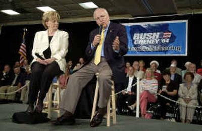 
Vice President Dick Cheney speaks during a town hall meeting in Davenport, Iowa, while his wife Lynne, left, looks on. At the meeting, Cheney said he supported allowing states to decide the gay marriage issue.
 (Associated Press / The Spokesman-Review)