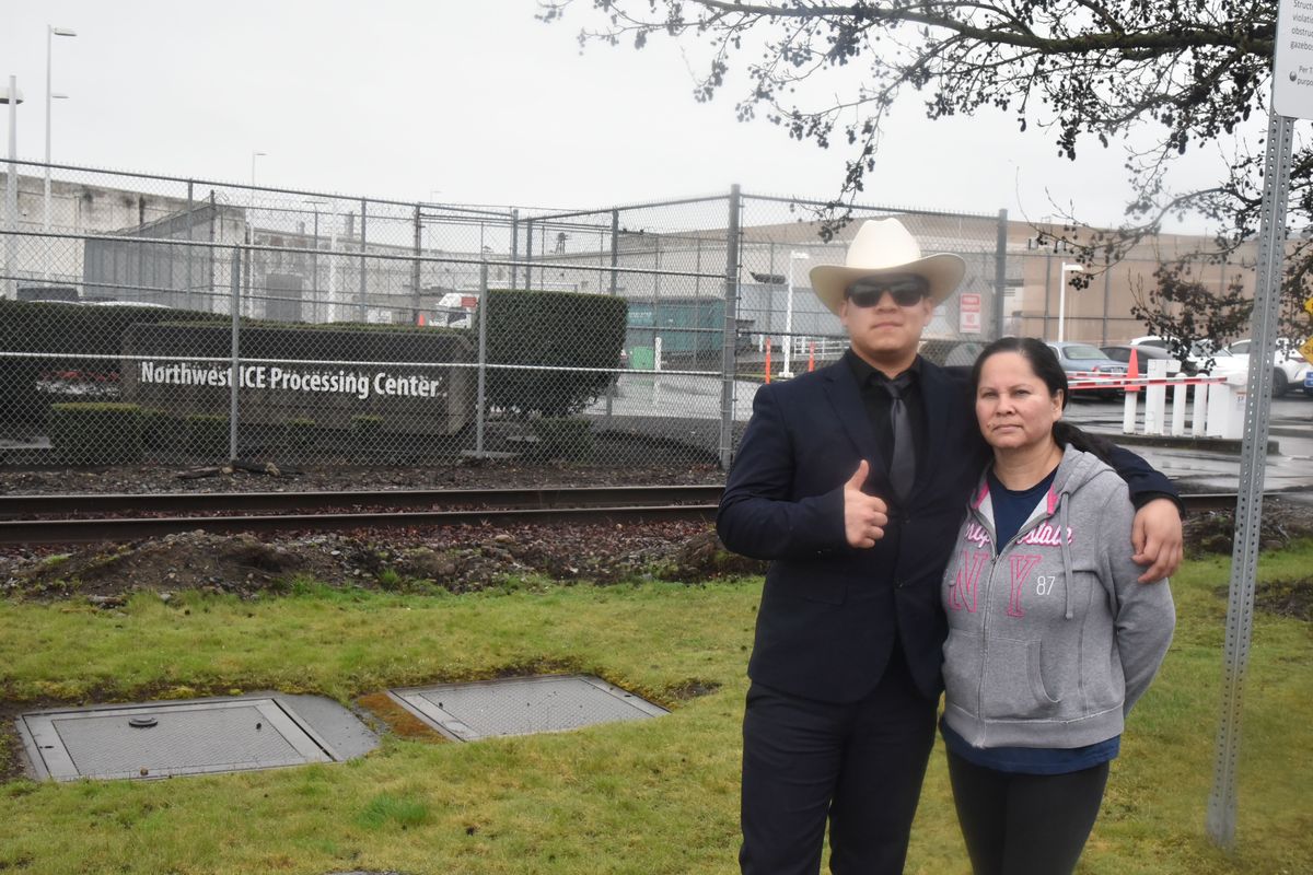 Raul Gomez-Eudave, left, stands with his mom, Micaela Eudave, outside of the Northwest Detention Center on Monday in Tacoma. (Mitchell Roland/THE SPOKESMAN-REVIEW)