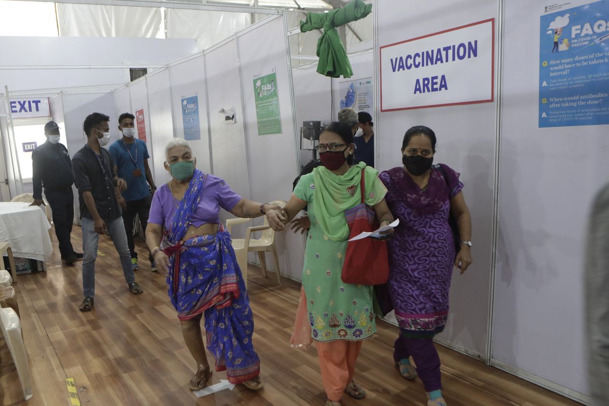 A woman leaves after receiving her second dose of the COVID-19 vaccine at a vaccination center that is closed for fresh registrations for first doses because of shortage the vaccine, in Mumbai, India, Friday, April 9, 2021. India has a seven-day rolling average of more than 100,000 cases per day and has reported 13 million virus cases since the pandemic began, the third-highest total after the United States and Brazil. (Rajanish Kakade)