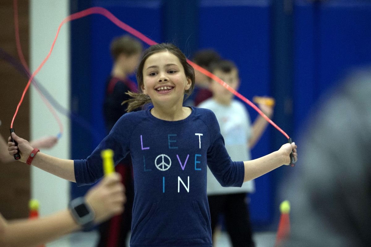 Wilson Elementary  fourth-grader Evy Kimball jumps rope during gym class at the school in Spokane on Monday, March 28, 2016. Spokane Public Schools is using Sqord, an activity tracker. (Kathy Plonka / The Spokesman-Review)