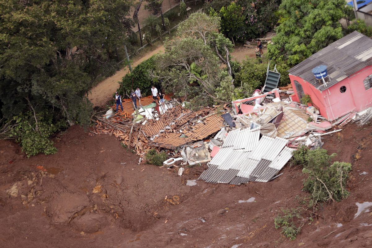 An aerial view shows a destroyed house after a dam collapsed in Brumadinho, Brazil, on Friday, Jan. 25, 2019. Rescuers searched for survivors in a huge area in southeastern Brazil buried by mud from the collapse of dam holding back mine waste, with several people dead and hundreds missing. (Andre Penner / AP)