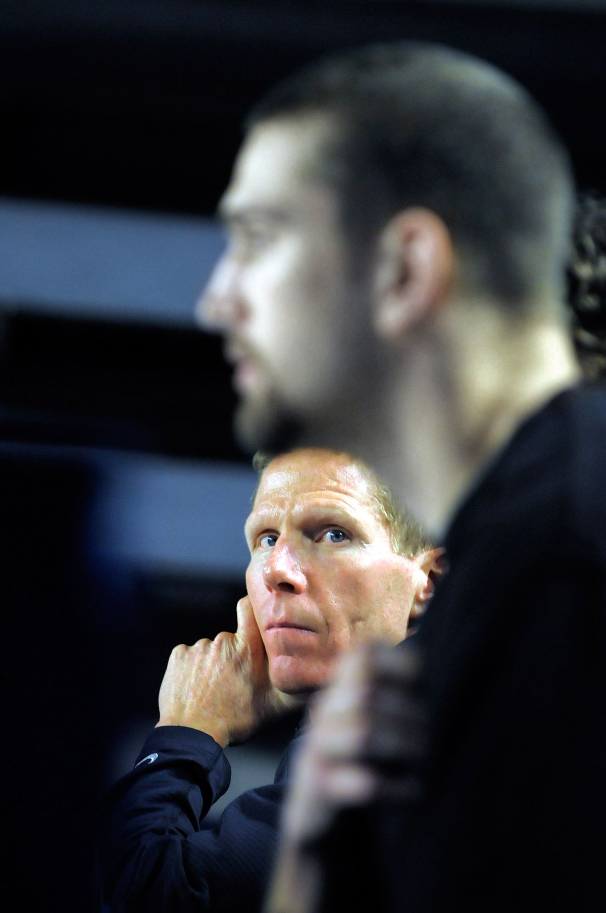 Coach Mark Few looks on as Josh Heytvelt fields questions from the media Wednesday. (Christopher Anderson / The Spokesman-Review)