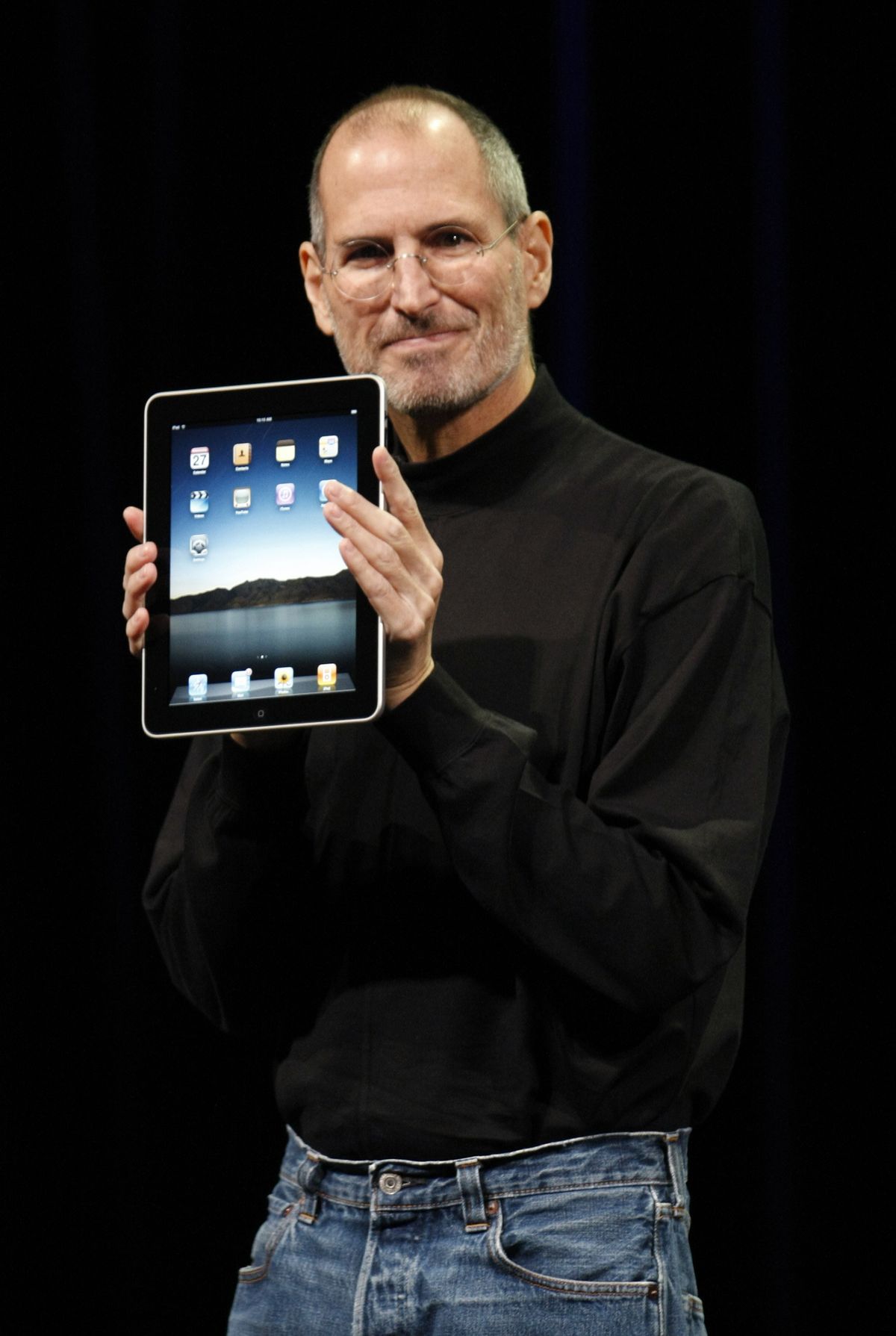 Apple CEO Steve Jobs shows off the new iPad during an Apple event in San Francisco on Wednesday, Jan. 27, 2010. (Paul Sakuma / Associated Press)
