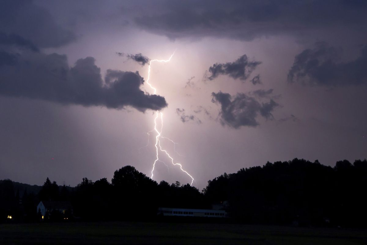 Lightning lights up the night sky In Neumarkt, Germany, Sunday, June 20, 2021. Heavy rains and thunderstorms have caused flooded cellars and streets as well as fallen trees and a variety of property damage in Central and Upper Franconia in the night to Monday.  (Tobias Hartl/Vifogra)