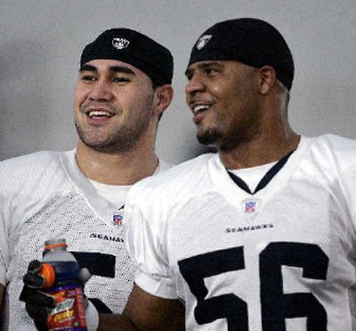 
Seattle Seahawks starting linebackers Lofa Tatupu, left, and Leroy Hill. 
 (Associated Press / The Spokesman-Review)