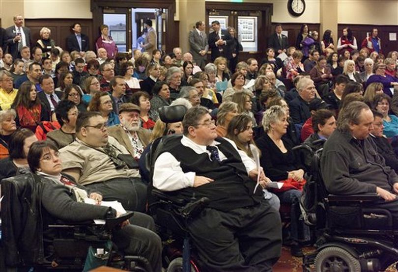 Hundreds of people attended the Joint Finance and Appropriations Committee special hearing on Medicaid cuts Friday Jan. 28, 2011at the Idaho Statehouse in Boise. The committee heard testimony from service providers, recipients and care givers of health and welfare programs that would be affected by any measures to reduce funding to Idaho's Medicaid system.
 (AP Photo/The Idaho Statesman / Darin Oswald)