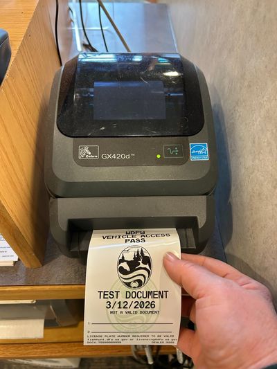 A test document is printed from the license printer at the Spokane Valley Washington Department of Fish and Wildlife office.  (Courtesy of Washington Department of Fish and Wildlife)