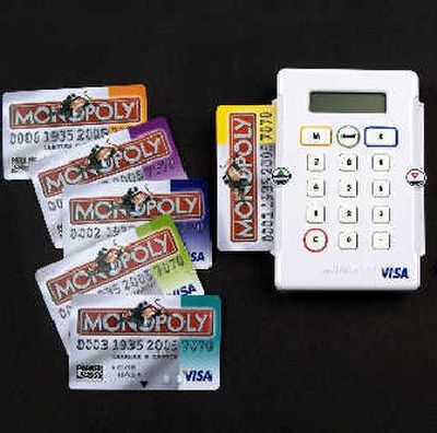 
A British version of Monopoly employs an electronic debit card system. 
 (Associated Press / The Spokesman-Review)
