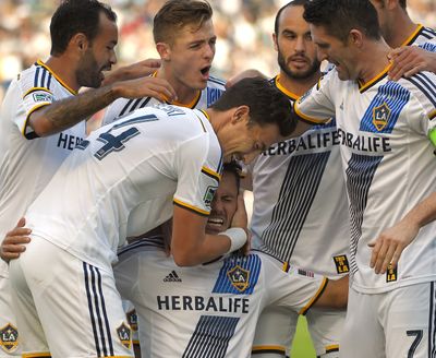 Galaxy midfielder Marcelo Sarvas, bottom center, celebrates his goal with teammates. (Associated Press)