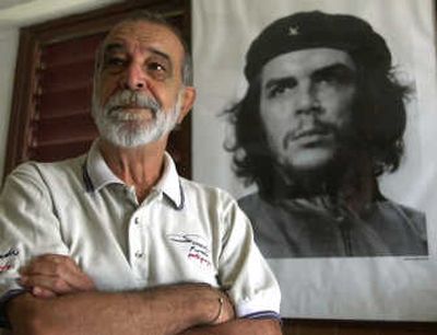 
Alberto Korda, 71, poses by his famous 1960 portrait of Cuban revolutionary hero Ernesto 