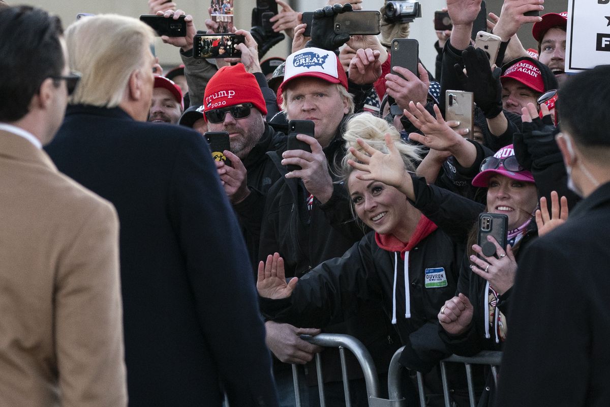 President Donald Trump greets an overflow crowd before speaking at a campaign rally Friday at Rochester (Minn.) International Airport.  (Alex Brandon)