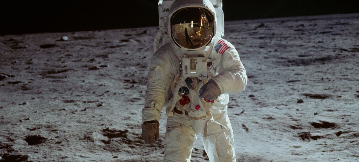 Buzz Aldrin on the lunar surface in “Apollo 11.” In Aldrin’s visor, you can see the reflection of Aldrin’s shadow, the Eagle lander and Neil Armstrong, who was taking the photograph. (Neon/CNNFilms / Handout)