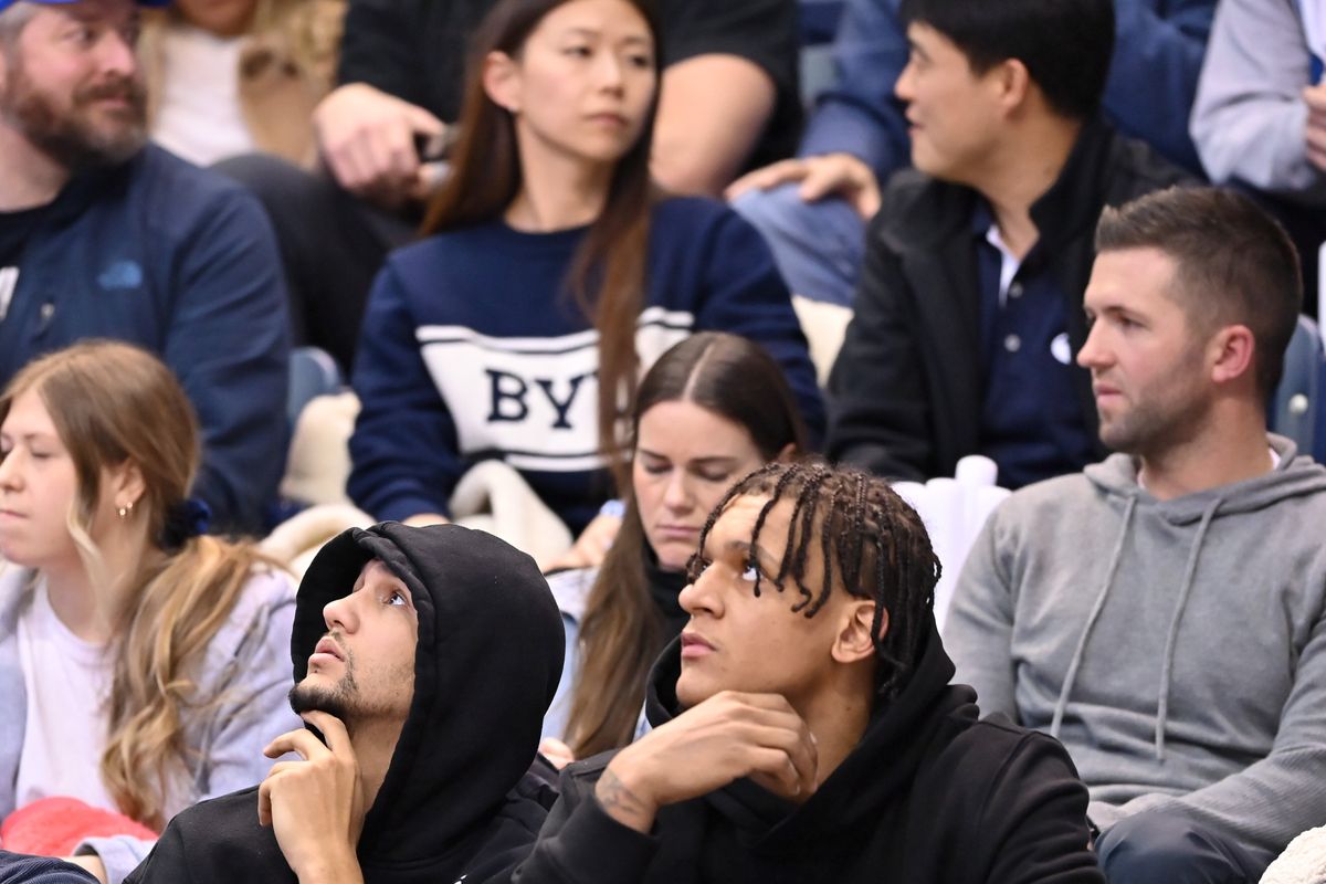 Former Gonzaga standout Jalen Suggs, left, and Orlando Magic teammate Paolo Banchero watch Gonzaga take on Brigham Young on Thursday in Provo, Utah.  (Tyler Tjomsland/The Spokesman-Review)