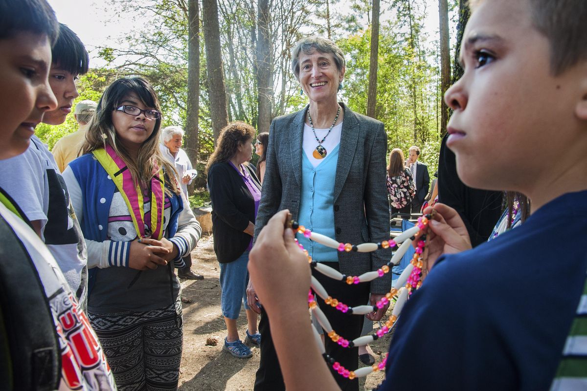 Interior Secretary Sally Jewell chats with Wellpinit fifth-grade students during her visit Thursday to the Spokane Indian Reservation. Douglas Reed, right, shows off his breastplate made of beads. When Jewell told the children her boss was President Barack Obama, they all shouted their names to tell the president they said hi. (Dan Pelle / The Spokesman-Review)