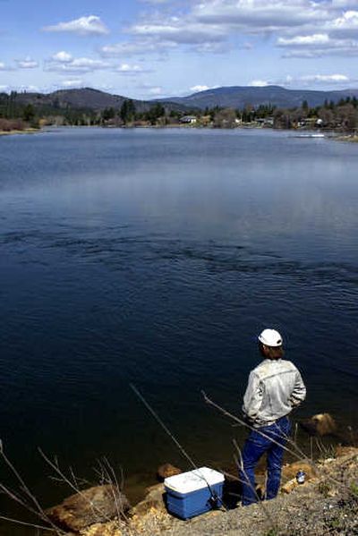 
Ray Patterson fishes for trout at Spirit Lake's Mill Pond in 2002. 
 (File / The Spokesman-Review)