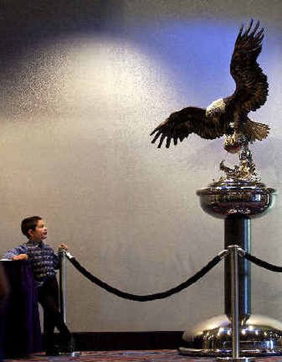 
Antoinne Holmes, 5, son of Curt Holmes, the vice chair of the Kalispel Tribal Council, checks out the bronze eagle by artist Chester Fields in the promenade in the new addition at Northern Quest Casino in Airway Heights on Sunday. The new addition boasts a family friendly entrance. 
 (Liz Kishimoto / The Spokesman-Review)
