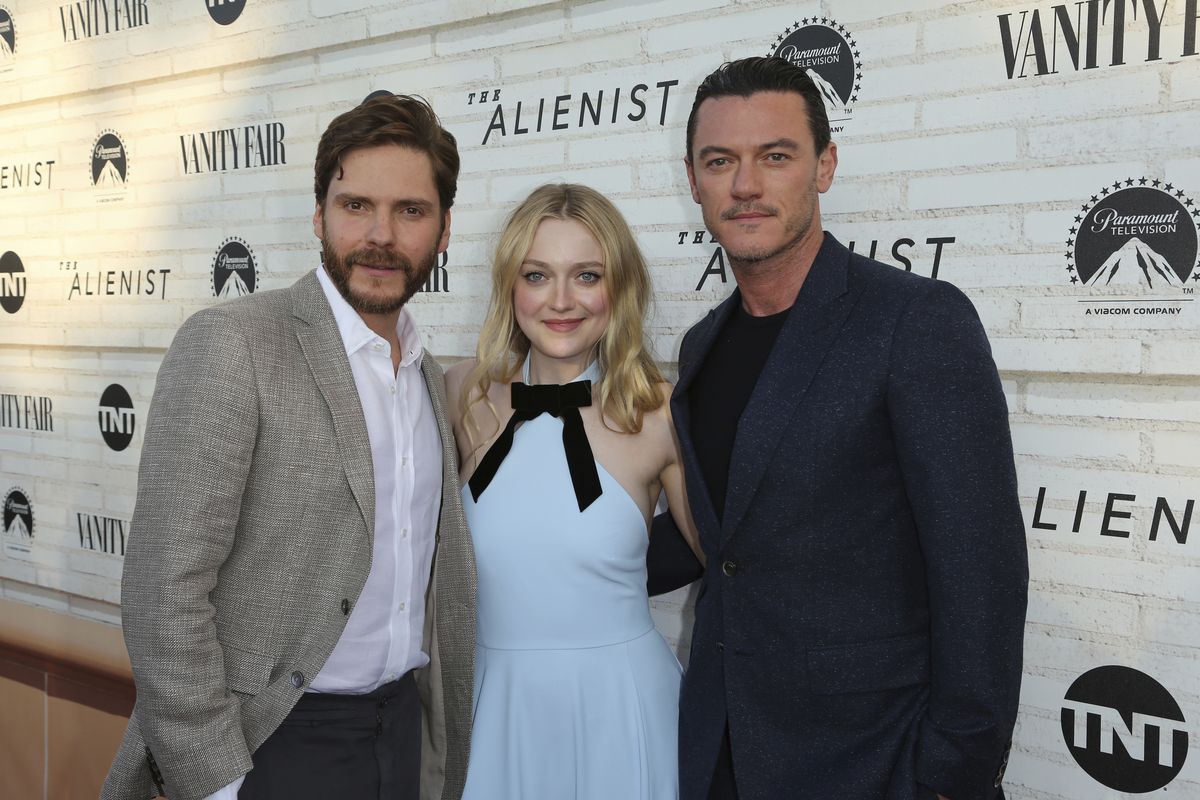 Daniel Bruhl, Dakota Fanning and Luke Evans, shown in 2018, are back for a second season of “The Alienist.”  (Willy Sanjuan/The Associated Press)