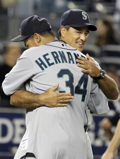 Seattle Mariners' Felix Hernandez, left, hugs manager Don Wakamatsu after Hernandez shut out the Yankees.  (Seth Wenig / Associated Press)